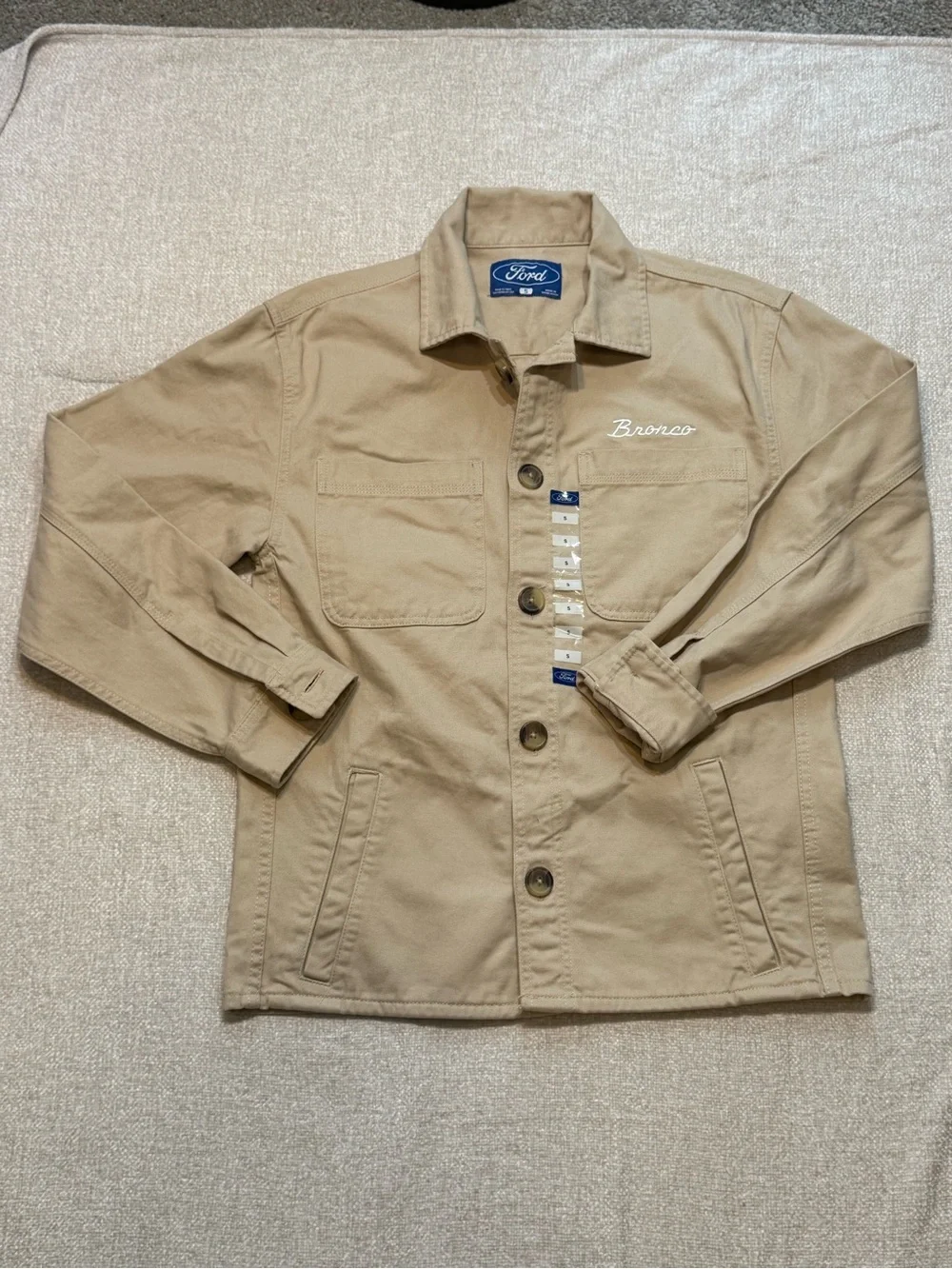 Brand new with tags, this official Ford Bronco utility chore jacket is a standou